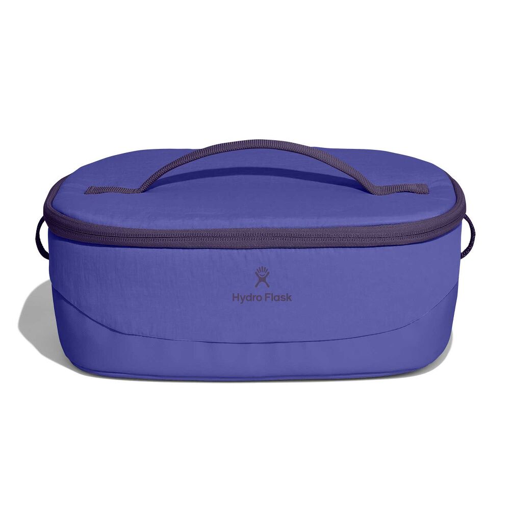 Purple Hydro Flask insulated lunch tote with oval shape, zip-around lid, top carry handle, small side handles, logo, and slightly textured finish with darker trim.